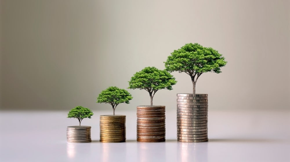 árvores em cima de moedas em crescimento gradativo investimentos esg